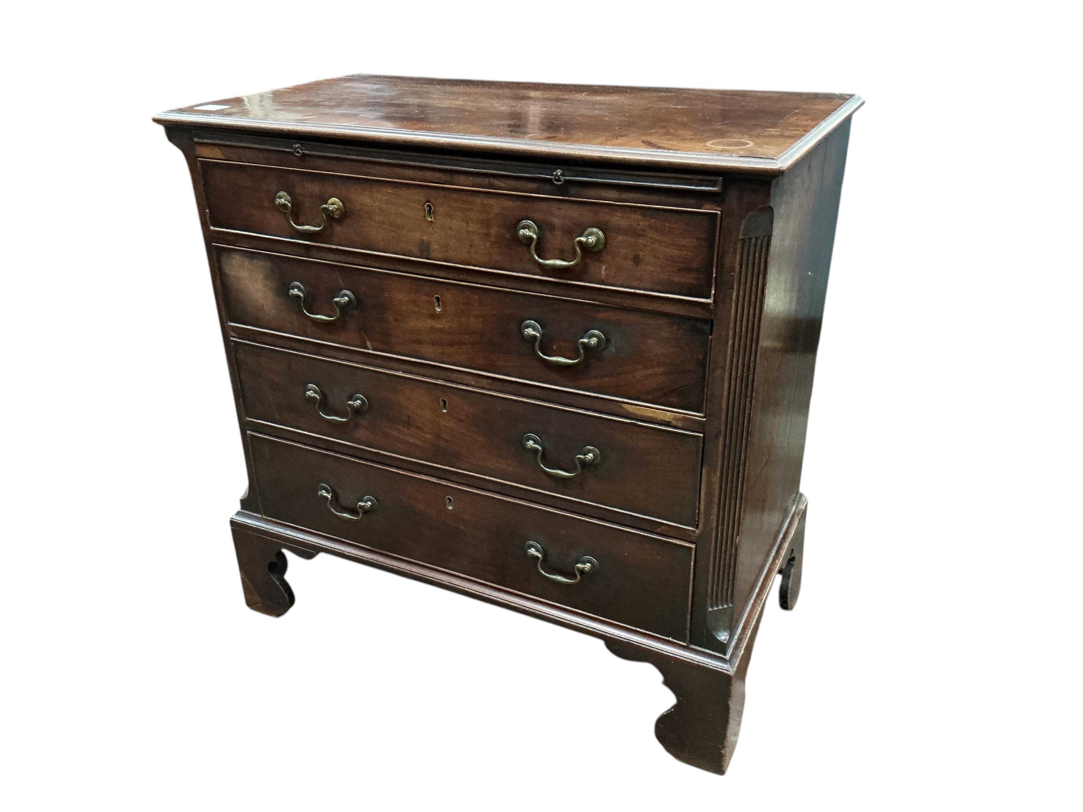 A George III mahogany chest of four drawers with brushing slide, width 87cm, depth 46cm, height 86cm